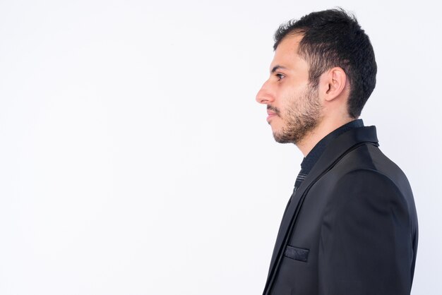 young bearded Persian businessman wearing suit isolated