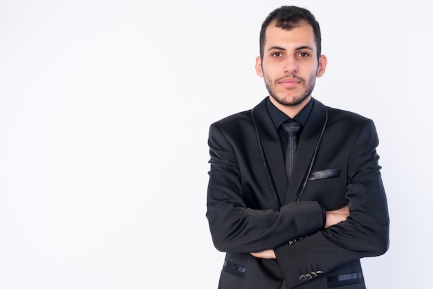 young bearded Persian businessman wearing suit isolated