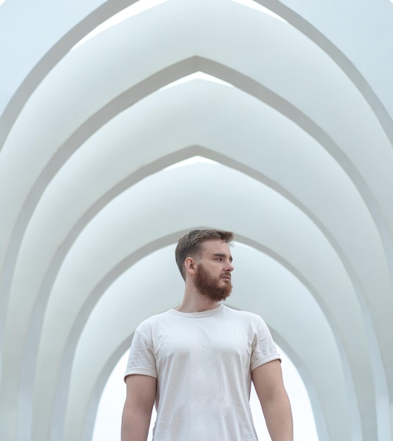 Young bearded religious man standing in temple white church pray meditate