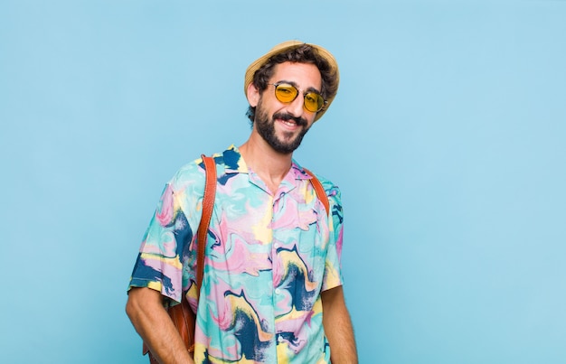 Young bearded tourist man smiling cheerfully