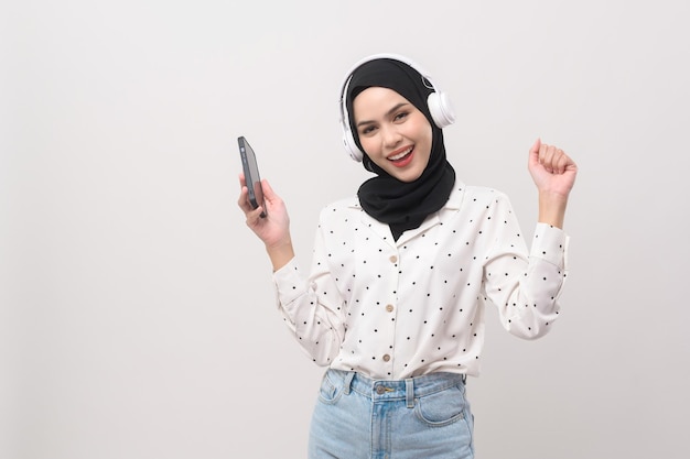 Young beautifu musliml woman wearing headset on white backgroundx9xA