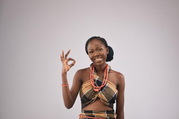 young beautiful African black girl smiling happily raising three fingers