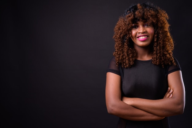 young beautiful African woman on black