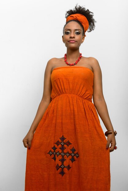 Young beautiful African woman with Afro hair wearing traditional clothes