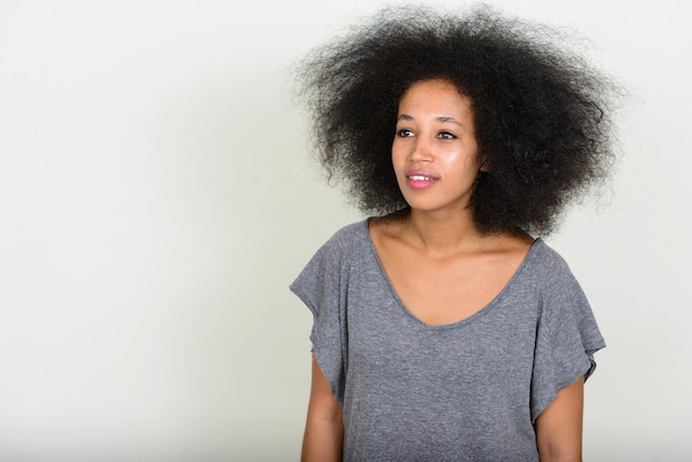 young beautiful African woman with Afro hair on white