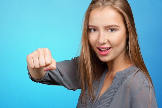 Young beautiful angry woman ready to fight