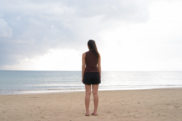 Young beautiful Asian tourist woman enjoying vacation