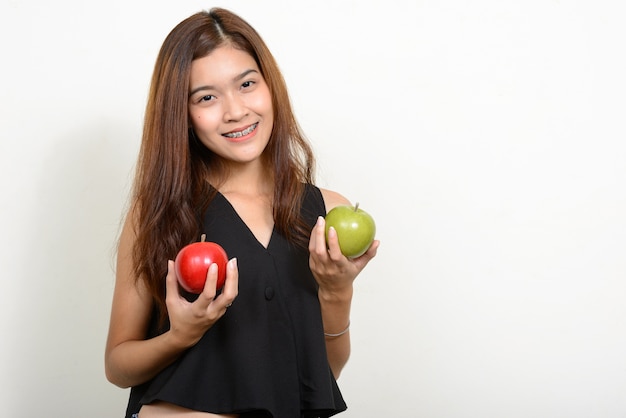 young beautiful Asian woman against white space