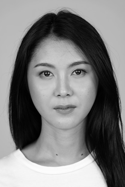 Young beautiful Asian woman isolated in black and white