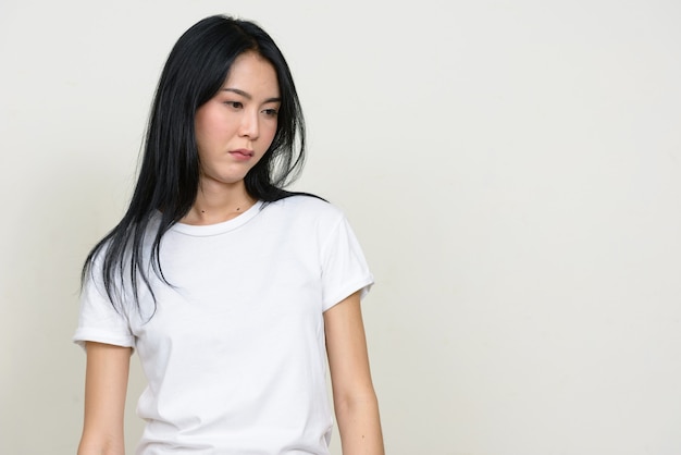 Young beautiful Asian woman isolated