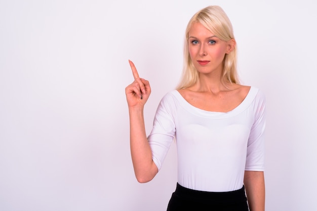 young beautiful blonde businesswoman against white space