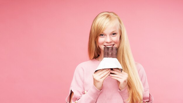 Young beautiful blonde with chocolate.