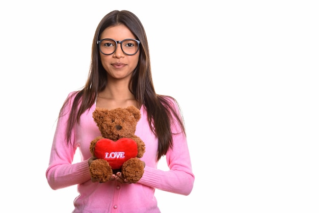 young beautiful Brazilian nerd woman holding tedd