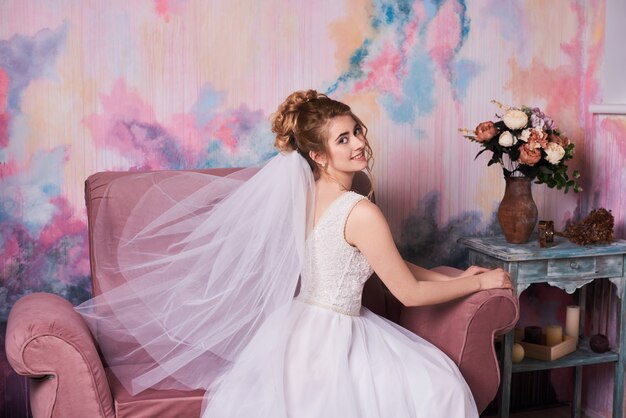 Young beautiful bride getting ready for wedding photo shoot 