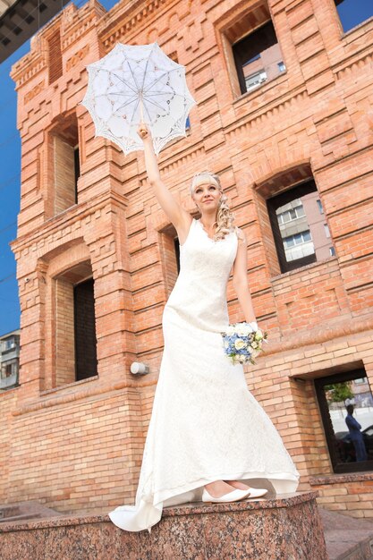 The young beautiful bride on the nature