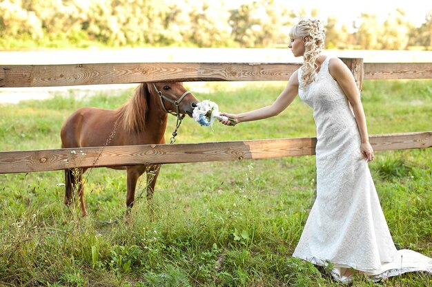 The young beautiful bride on the nature