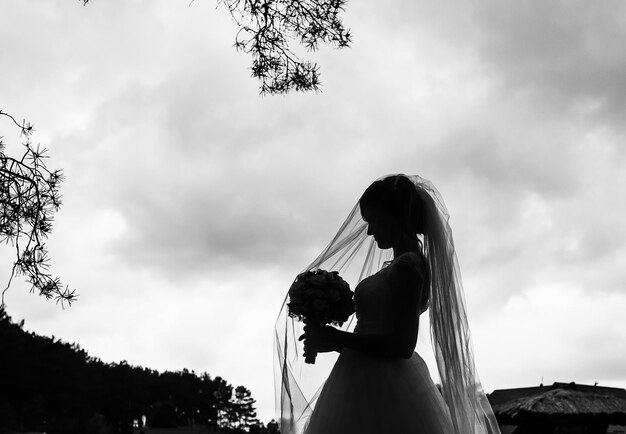 Young beautiful bride on the nature