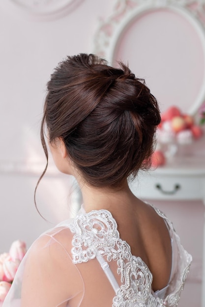 Young beautiful bride with brunette wedding hairstyle