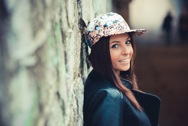 young beautiful brunette straight hair woman in the park 