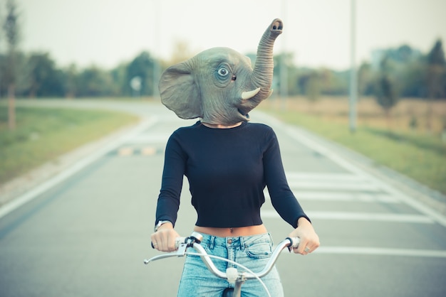 young beautiful brunette straight hair woman using bike