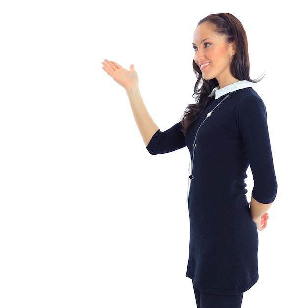 A young beautiful business woman pointing at copyspace