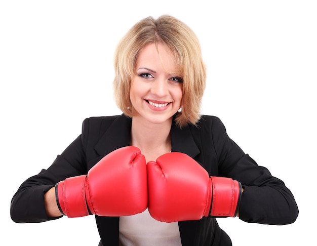 Young beautiful business woman with boxing gloves isolated on white