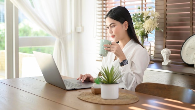 Young beautiful businesswoman using laptop business Work from home concept