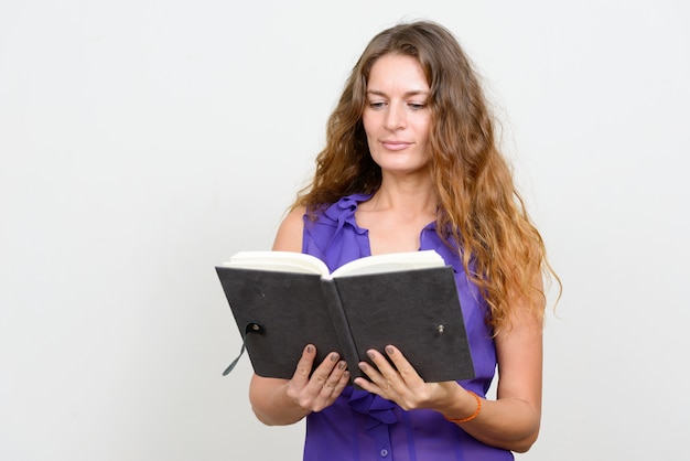 young beautiful businesswoman with curly blond hair on white