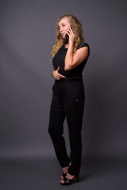 young beautiful businesswoman with long wavy blond hair