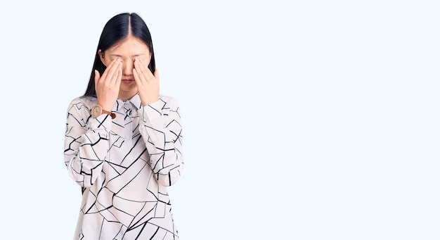 Young beautiful chinese woman wearing casual shirt rubbing eyes for fatigue and headache sleepy and tired expression vision problem