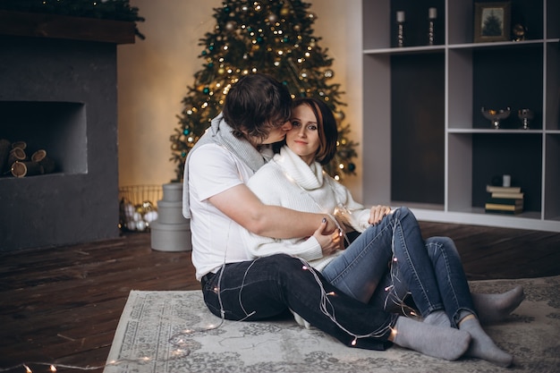 Young beautiful couple celebrating Christmas