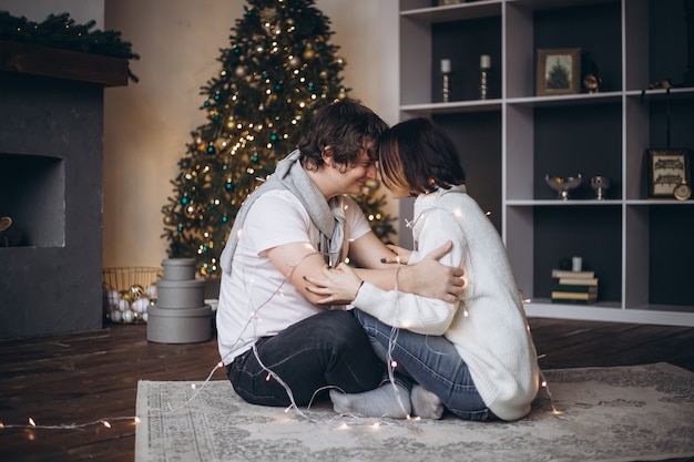 Young beautiful couple celebrating Christmas