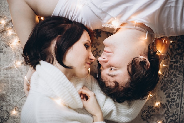 Young beautiful couple celebrating Christmas