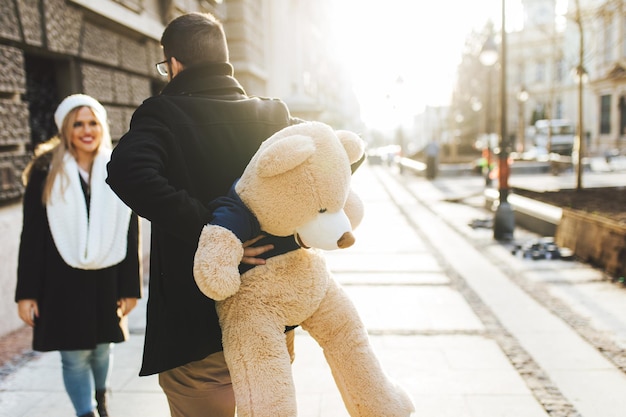 Young beautiful couple enjoying city walk at Valentine's day.