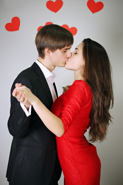 Young beautiful couple in love tenderly kissing