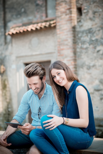 young beautiful couple lovers using tablet 