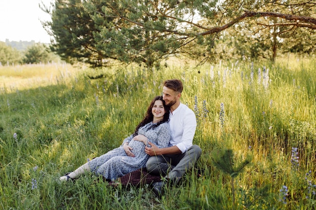 Young beautiful couple spend time in the garden