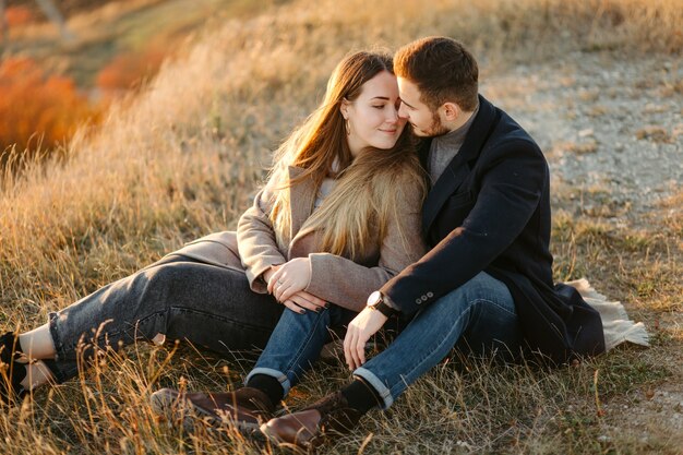 Young and beautiful  couple walking outdoors on a sunny day