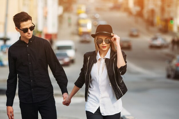 Young beautiful couple walking in the street