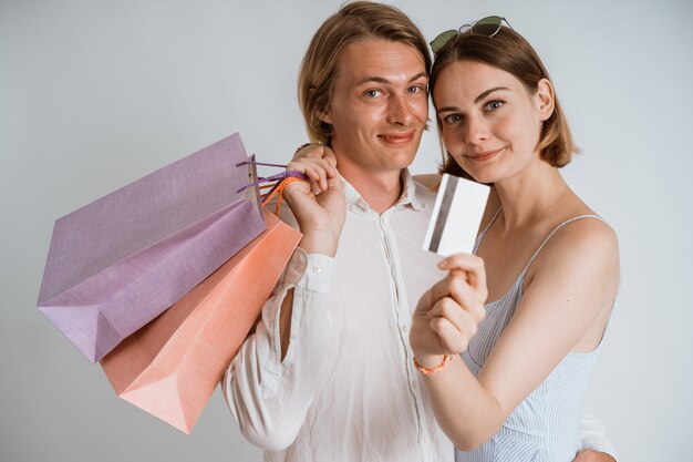 Young beautiful couple with shopping bags