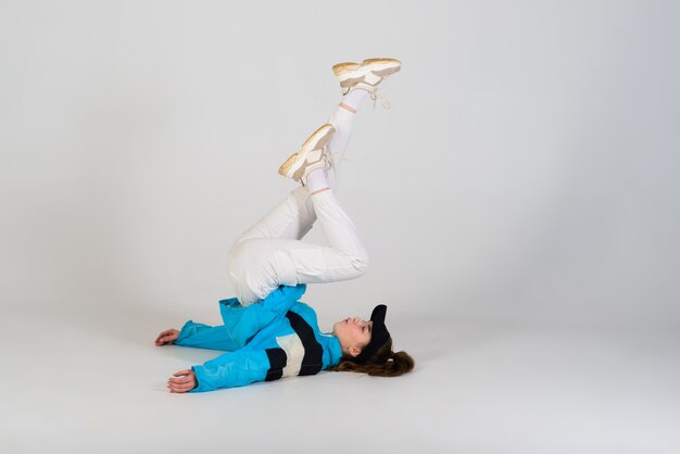 Young beautiful dancer posing on a studio background