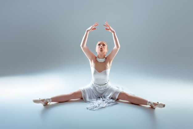 Young beautiful dancer warming-up 