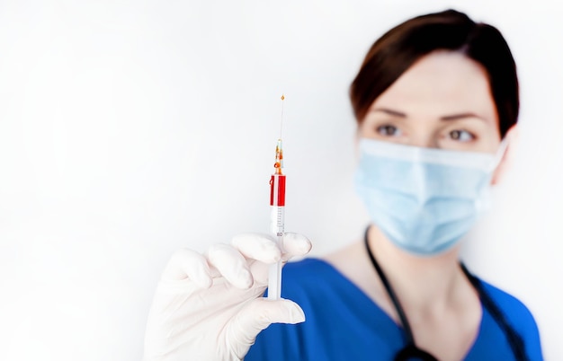 Young beautiful doctor with a protective mask