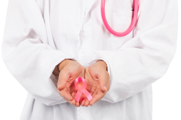 Young beautiful doctor woman with pink stethoscope and pink awareness ribbon for breast cancer on a white.