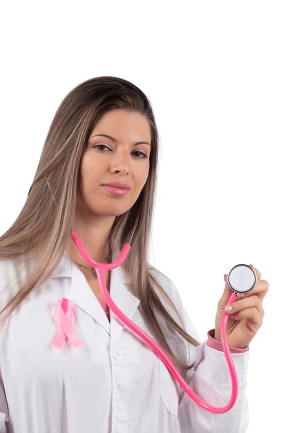 Young beautiful doctor woman with pink stethoscope and pink awareness ribbon for breast cancer.