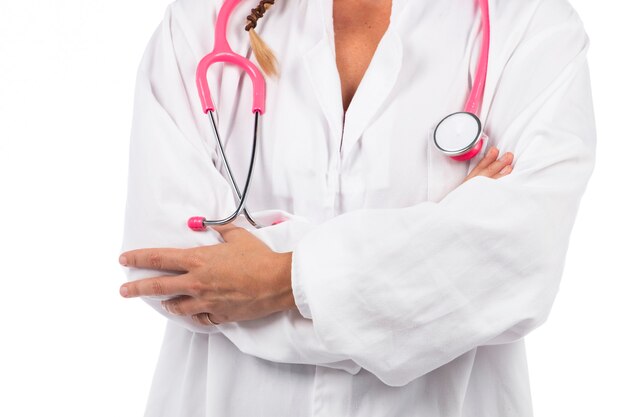 Young beautiful doctor woman with pink stethoscope on a white.