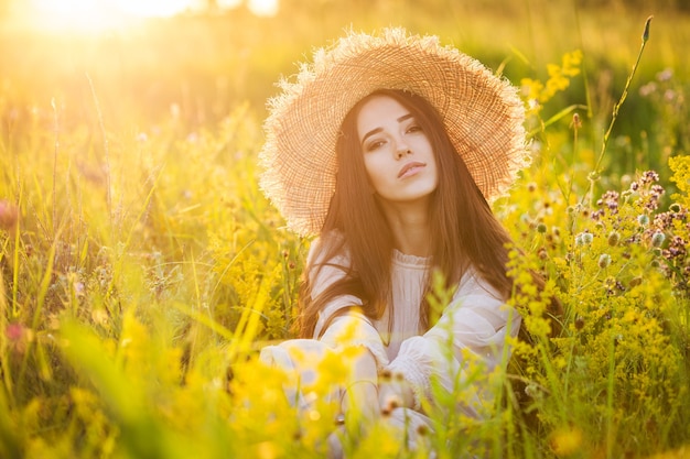 Young beautiful european girl in the setting sun