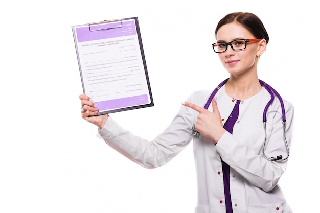 Young beautiful female doctor showing on clipboard with her hand on white 