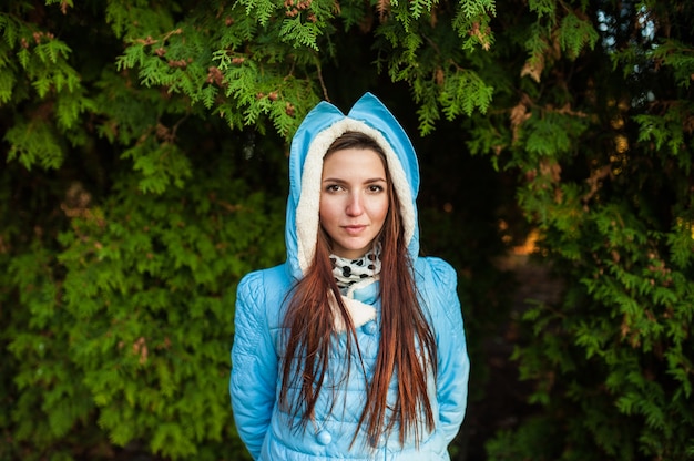 Young beautiful girl in a blue jacket