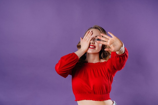 A young beautiful girl covering face